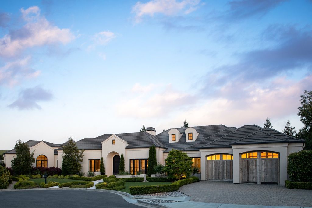 10450 Serra Street Home in Cupertino, California. A Private Silicon Valley Haven - This exceptional estate is tucked away in a tranquil cul-de-sac, providing a serene retreat within close proximity to the vibrant Silicon Valley. Surrounded by the natural beauty of Rancho San Antonio Preserve, this stunning home offers hiking and biking trails and breathtaking views. 