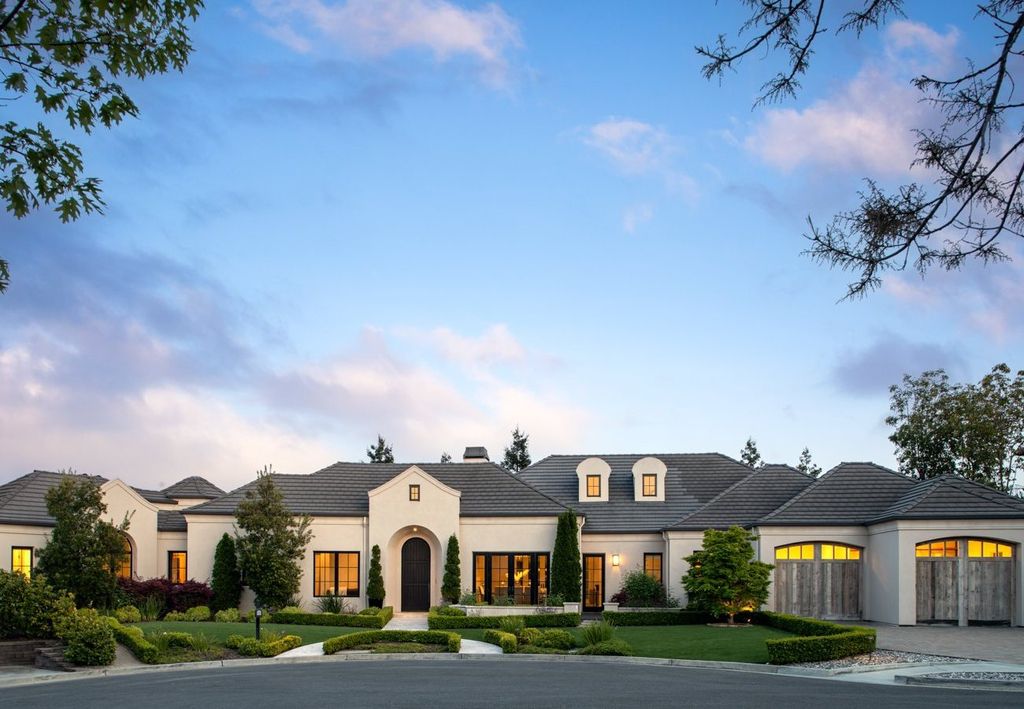 10450 Serra Street Home in Cupertino, California. A Private Silicon Valley Haven - This exceptional estate is tucked away in a tranquil cul-de-sac, providing a serene retreat within close proximity to the vibrant Silicon Valley. Surrounded by the natural beauty of Rancho San Antonio Preserve, this stunning home offers hiking and biking trails and breathtaking views. 