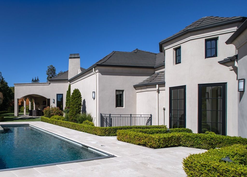 10450 Serra Street Home in Cupertino, California. A Private Silicon Valley Haven - This exceptional estate is tucked away in a tranquil cul-de-sac, providing a serene retreat within close proximity to the vibrant Silicon Valley. Surrounded by the natural beauty of Rancho San Antonio Preserve, this stunning home offers hiking and biking trails and breathtaking views. 