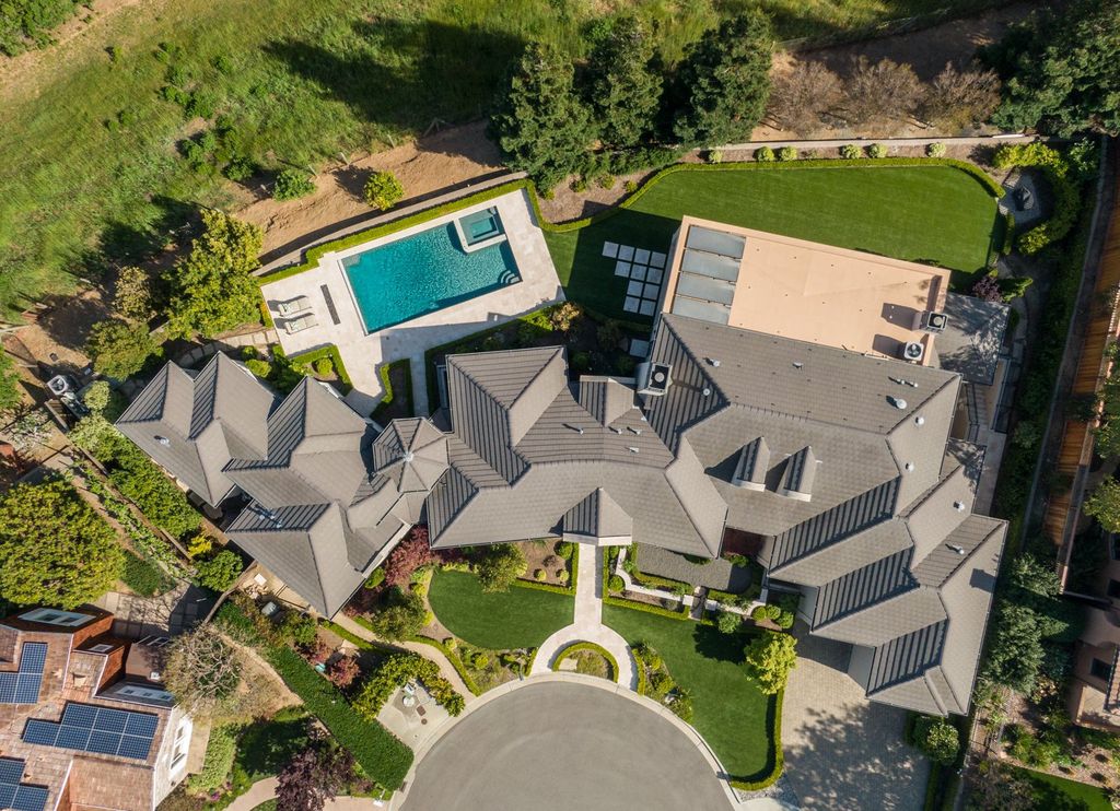 10450 Serra Street Home in Cupertino, California. A Private Silicon Valley Haven - This exceptional estate is tucked away in a tranquil cul-de-sac, providing a serene retreat within close proximity to the vibrant Silicon Valley. Surrounded by the natural beauty of Rancho San Antonio Preserve, this stunning home offers hiking and biking trails and breathtaking views. 