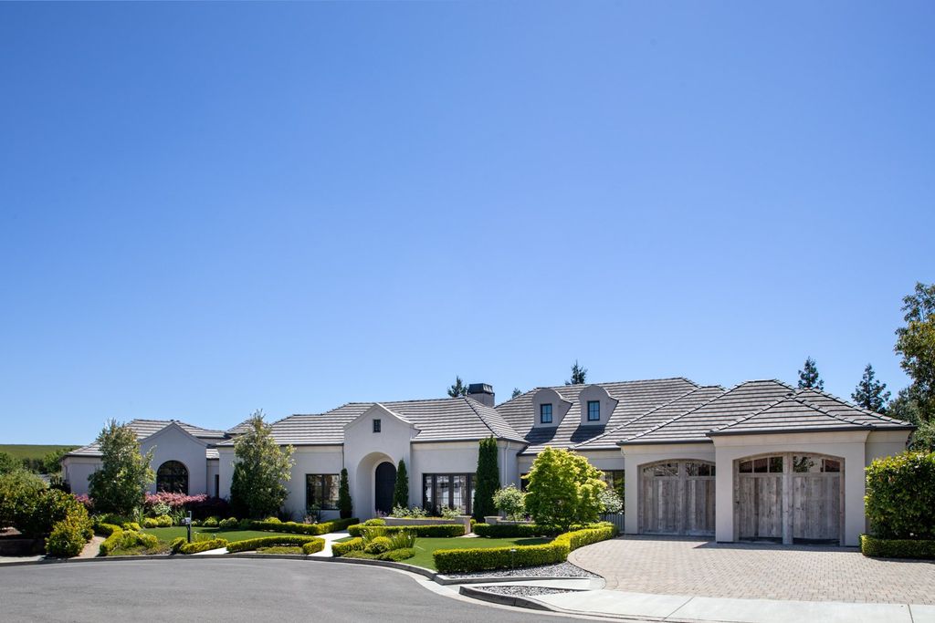 10450 Serra Street Home in Cupertino, California. A Private Silicon Valley Haven - This exceptional estate is tucked away in a tranquil cul-de-sac, providing a serene retreat within close proximity to the vibrant Silicon Valley. Surrounded by the natural beauty of Rancho San Antonio Preserve, this stunning home offers hiking and biking trails and breathtaking views. 
