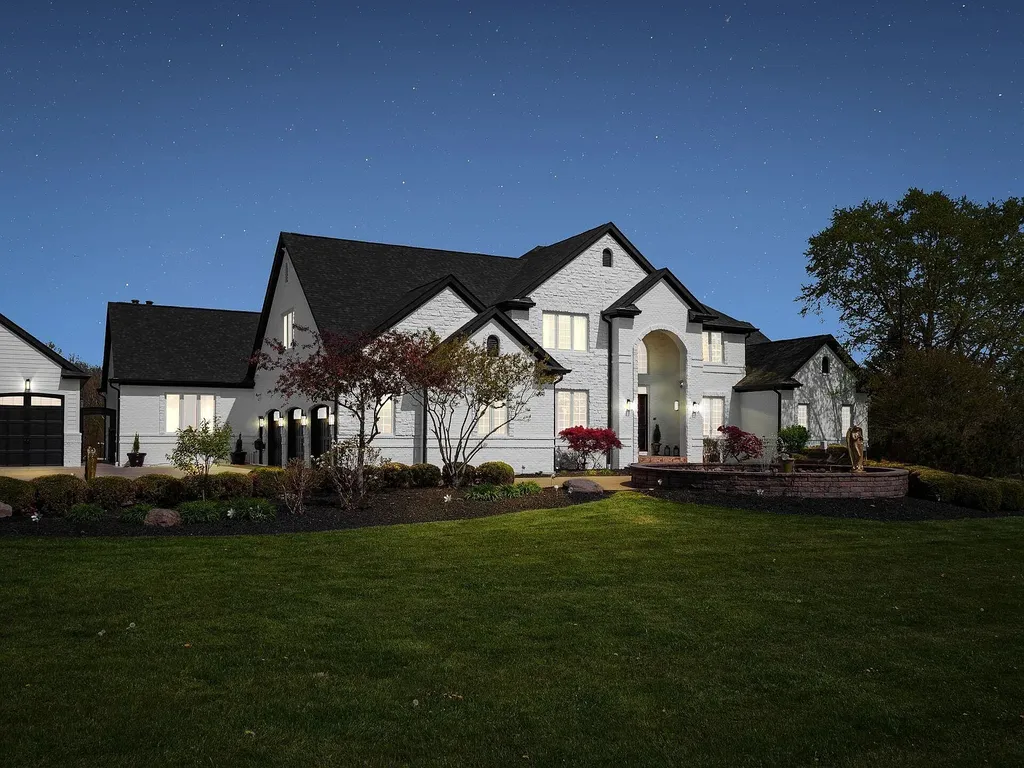 12100 Toll Gate Court NW Home in Pickerington, Ohio. Discover an entertainer's dream with this extraordinary 19.66 acre estate boasting over 16,000 square feet of living space. Immerse yourself in serene surroundings, including a creek, pond, and lush wooded areas, all complemented by a 6-car garage. Indulge in the opulent charm of the 6-bedroom, 6.5-bathroom main house, along with a separate 3-bedroom, 2-bathroom guest house. 