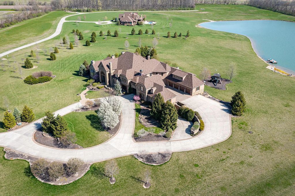 12304 E 196th Street Home in Noblesville, Indiana. Experience luxurious living in this exquisite estate located in Canterbury Estates, Noblesville, Indiana. With 6 bedrooms, 10 bathrooms, and over 19,000 square feet of living space on a 13-acre lot, this property offers complete privacy and stunning views overlooking a 7-acre stocked pond.