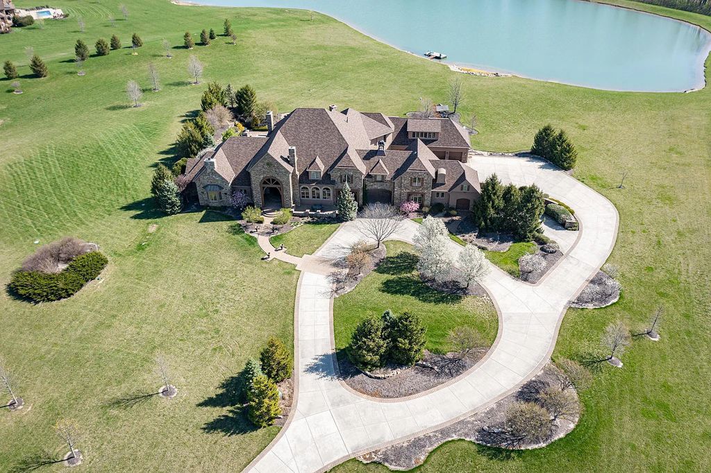 12304 E 196th Street Home in Noblesville, Indiana. Experience luxurious living in this exquisite estate located in Canterbury Estates, Noblesville, Indiana. With 6 bedrooms, 10 bathrooms, and over 19,000 square feet of living space on a 13-acre lot, this property offers complete privacy and stunning views overlooking a 7-acre stocked pond.