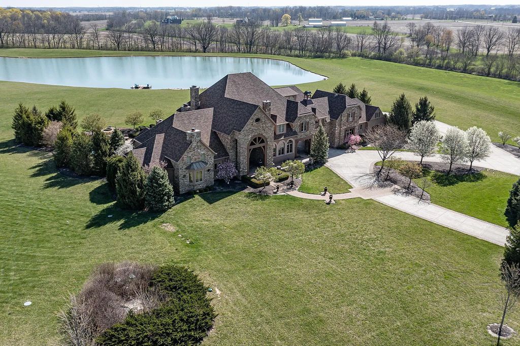 12304 E 196th Street Home in Noblesville, Indiana. Experience luxurious living in this exquisite estate located in Canterbury Estates, Noblesville, Indiana. With 6 bedrooms, 10 bathrooms, and over 19,000 square feet of living space on a 13-acre lot, this property offers complete privacy and stunning views overlooking a 7-acre stocked pond.