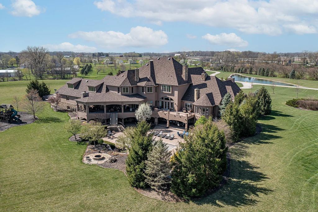 12304 E 196th Street Home in Noblesville, Indiana. Experience luxurious living in this exquisite estate located in Canterbury Estates, Noblesville, Indiana. With 6 bedrooms, 10 bathrooms, and over 19,000 square feet of living space on a 13-acre lot, this property offers complete privacy and stunning views overlooking a 7-acre stocked pond.