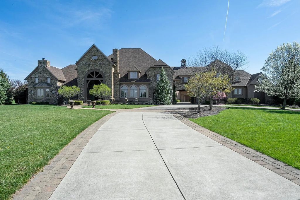 12304 E 196th Street Home in Noblesville, Indiana. Experience luxurious living in this exquisite estate located in Canterbury Estates, Noblesville, Indiana. With 6 bedrooms, 10 bathrooms, and over 19,000 square feet of living space on a 13-acre lot, this property offers complete privacy and stunning views overlooking a 7-acre stocked pond.