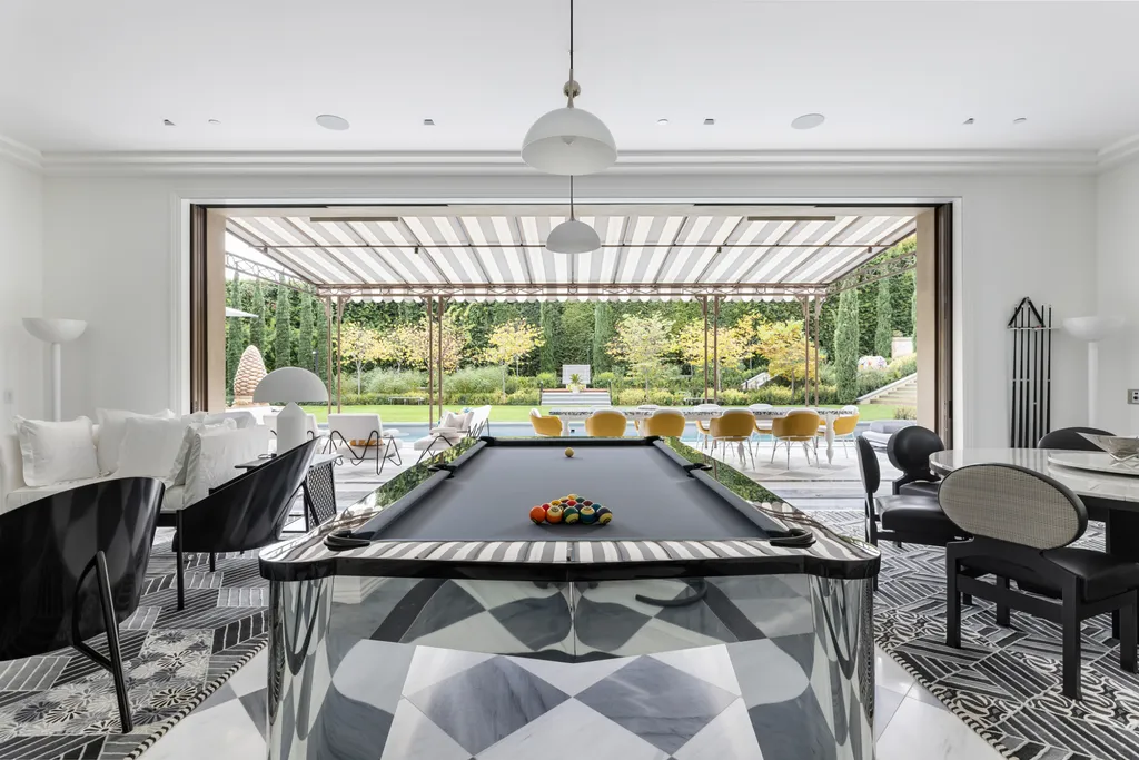 12770 S Bristol Circle Home in Los Angeles, California. Welcome to Bristol Chateau, a stunning classical residence designed by Studio William Hefner in the prestigious Brentwood Park neighborhood. This remarkable estate presents a seamless blend of traditional and contemporary styles. With meticulous attention to detail, Hefner has transformed this French chateau-inspired property into a truly exceptional living space.