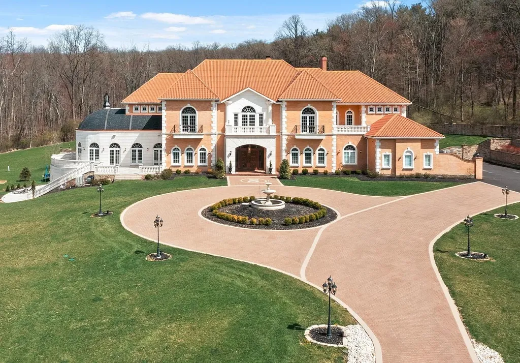 1284 Eagle Road Home in New Hope, Pennsylvania. Prepare to be mesmerized by this extraordinary palatial estate home nestled in the highly sought-after Upper Makefield area of Bucks County. Poised on 11+ acres and seamlessly integrated into the hillside of Jericho Mountain, this remarkable residence spans over 19,000 square feet, offering a level of detail and amenities that are truly unparalleled. A stunning example of French European architecture, this one-of-a-kind mansion boasts a myriad of exquisite features and finishes that will leave you in awe.