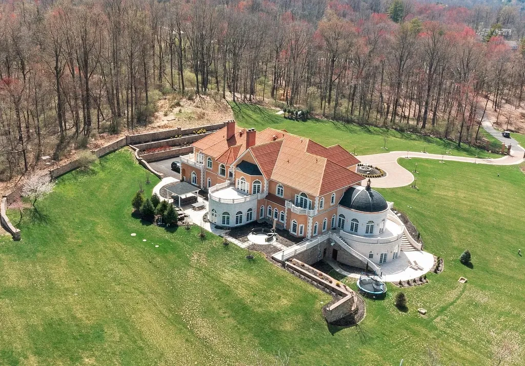 1284 Eagle Road Home in New Hope, Pennsylvania. Prepare to be mesmerized by this extraordinary palatial estate home nestled in the highly sought-after Upper Makefield area of Bucks County. Poised on 11+ acres and seamlessly integrated into the hillside of Jericho Mountain, this remarkable residence spans over 19,000 square feet, offering a level of detail and amenities that are truly unparalleled. A stunning example of French European architecture, this one-of-a-kind mansion boasts a myriad of exquisite features and finishes that will leave you in awe.