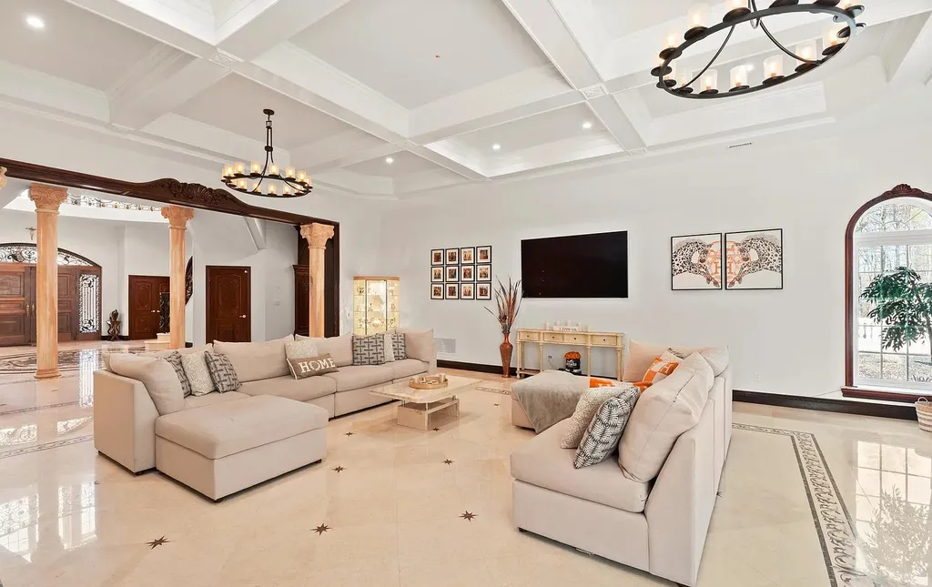 1284 Eagle Road Home in New Hope, Pennsylvania. Prepare to be mesmerized by this extraordinary palatial estate home nestled in the highly sought-after Upper Makefield area of Bucks County. Poised on 11+ acres and seamlessly integrated into the hillside of Jericho Mountain, this remarkable residence spans over 19,000 square feet, offering a level of detail and amenities that are truly unparalleled. A stunning example of French European architecture, this one-of-a-kind mansion boasts a myriad of exquisite features and finishes that will leave you in awe.