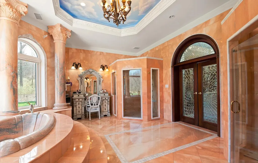 1284 Eagle Road Home in New Hope, Pennsylvania. Prepare to be mesmerized by this extraordinary palatial estate home nestled in the highly sought-after Upper Makefield area of Bucks County. Poised on 11+ acres and seamlessly integrated into the hillside of Jericho Mountain, this remarkable residence spans over 19,000 square feet, offering a level of detail and amenities that are truly unparalleled. A stunning example of French European architecture, this one-of-a-kind mansion boasts a myriad of exquisite features and finishes that will leave you in awe.