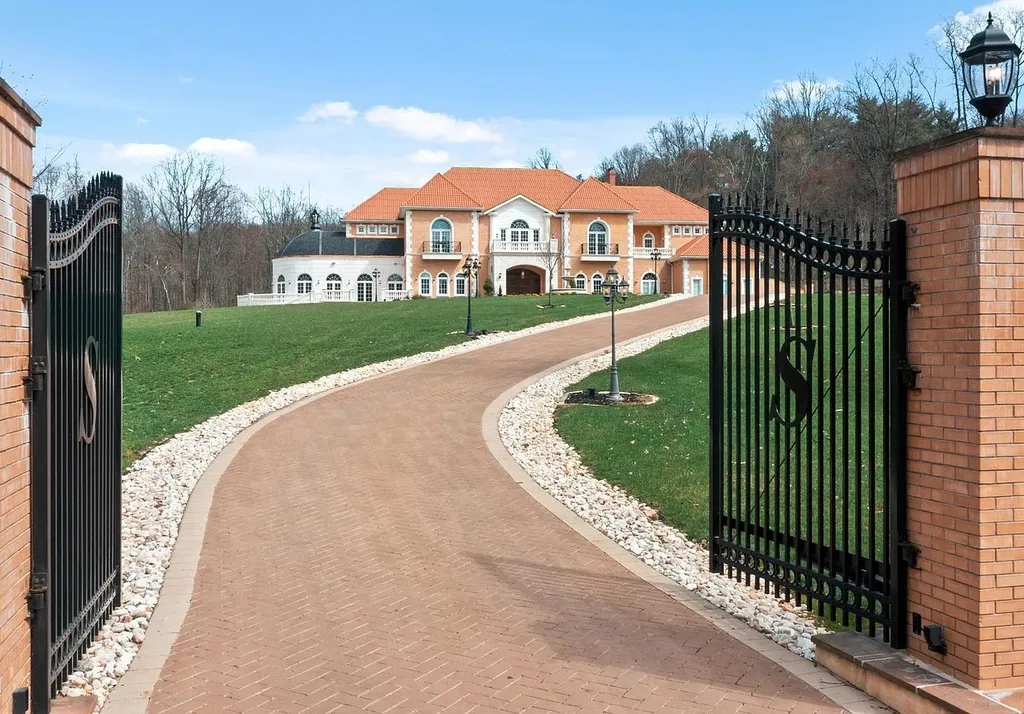1284 Eagle Road Home in New Hope, Pennsylvania. Prepare to be mesmerized by this extraordinary palatial estate home nestled in the highly sought-after Upper Makefield area of Bucks County. Poised on 11+ acres and seamlessly integrated into the hillside of Jericho Mountain, this remarkable residence spans over 19,000 square feet, offering a level of detail and amenities that are truly unparalleled. A stunning example of French European architecture, this one-of-a-kind mansion boasts a myriad of exquisite features and finishes that will leave you in awe.