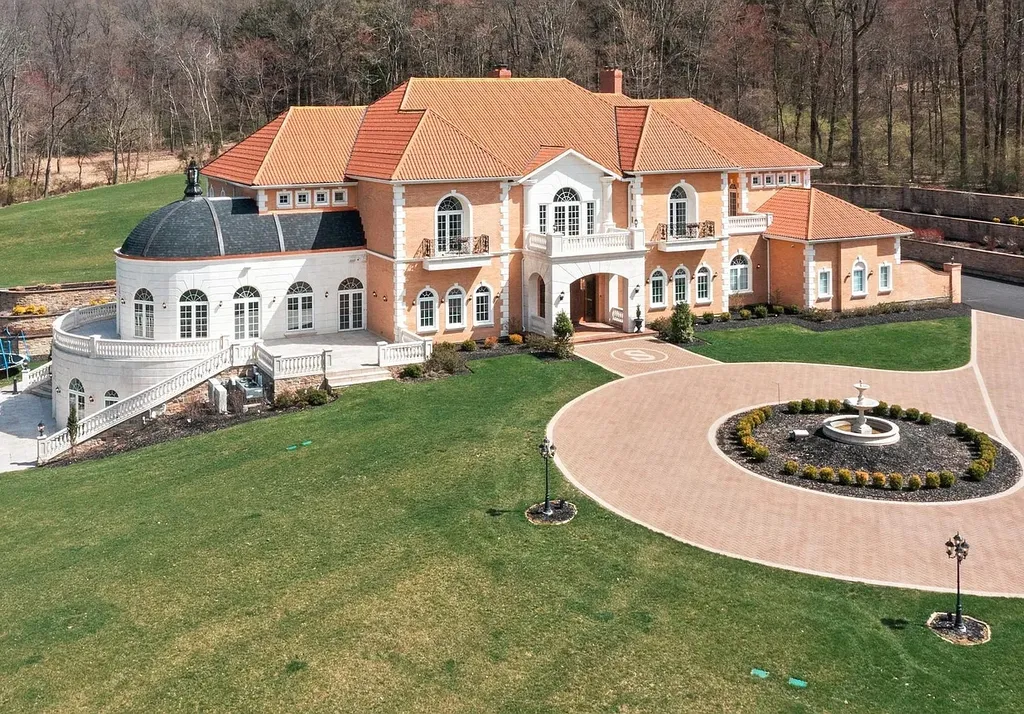 1284 Eagle Road Home in New Hope, Pennsylvania. Prepare to be mesmerized by this extraordinary palatial estate home nestled in the highly sought-after Upper Makefield area of Bucks County. Poised on 11+ acres and seamlessly integrated into the hillside of Jericho Mountain, this remarkable residence spans over 19,000 square feet, offering a level of detail and amenities that are truly unparalleled. A stunning example of French European architecture, this one-of-a-kind mansion boasts a myriad of exquisite features and finishes that will leave you in awe.