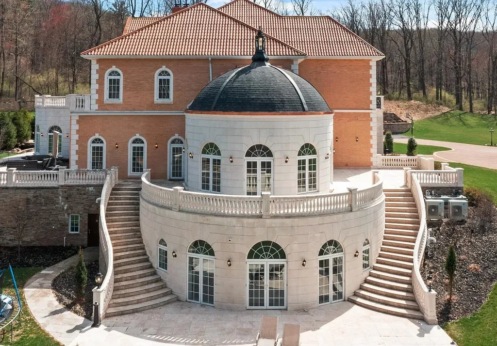 1284 Eagle Road Home in New Hope, Pennsylvania. Prepare to be mesmerized by this extraordinary palatial estate home nestled in the highly sought-after Upper Makefield area of Bucks County. Poised on 11+ acres and seamlessly integrated into the hillside of Jericho Mountain, this remarkable residence spans over 19,000 square feet, offering a level of detail and amenities that are truly unparalleled. A stunning example of French European architecture, this one-of-a-kind mansion boasts a myriad of exquisite features and finishes that will leave you in awe.