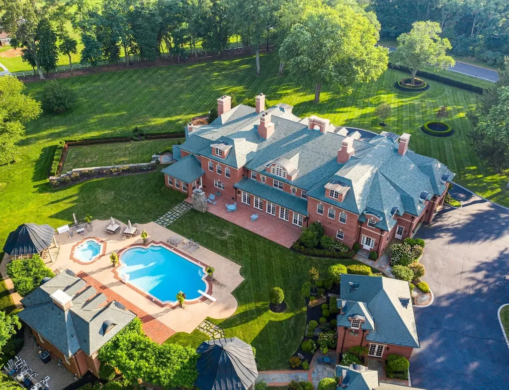 152 Bucks Mill Road Home in Colts Neck, New Jersey. One of the most magnificent estates in Colts Neck Township, New Jersey, where elegance and sophistication intertwine to create a truly exceptional living experience. As you pass through the iron gates and step onto the breathtaking grounds, it becomes evident that you have arrived at a place of unparalleled luxury.