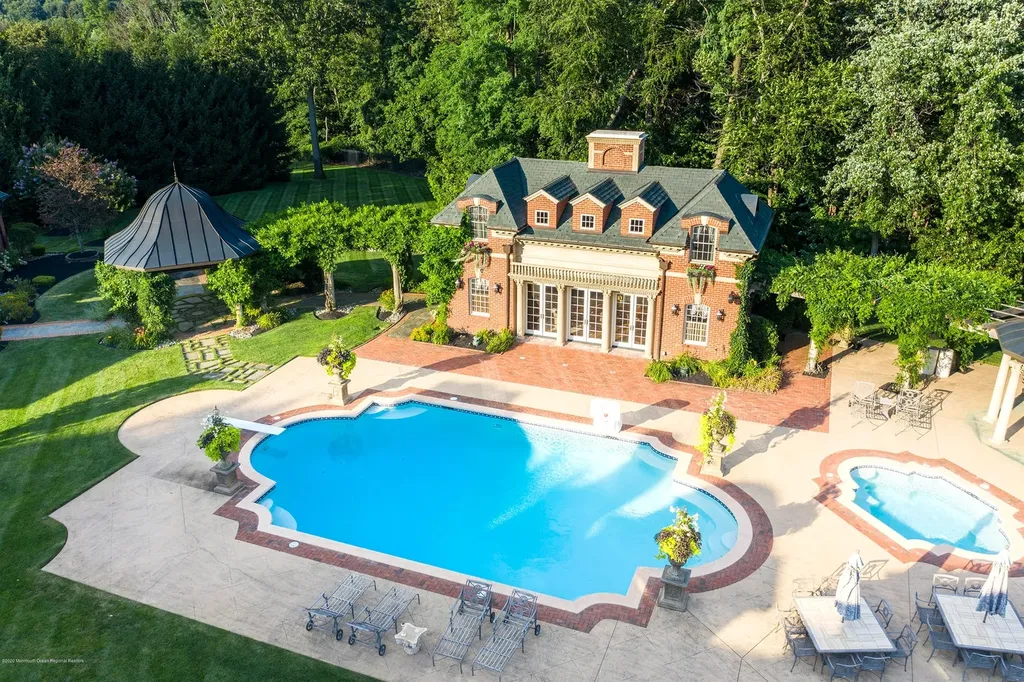 152 Bucks Mill Road Home in Colts Neck, New Jersey. One of the most magnificent estates in Colts Neck Township, New Jersey, where elegance and sophistication intertwine to create a truly exceptional living experience. As you pass through the iron gates and step onto the breathtaking grounds, it becomes evident that you have arrived at a place of unparalleled luxury.