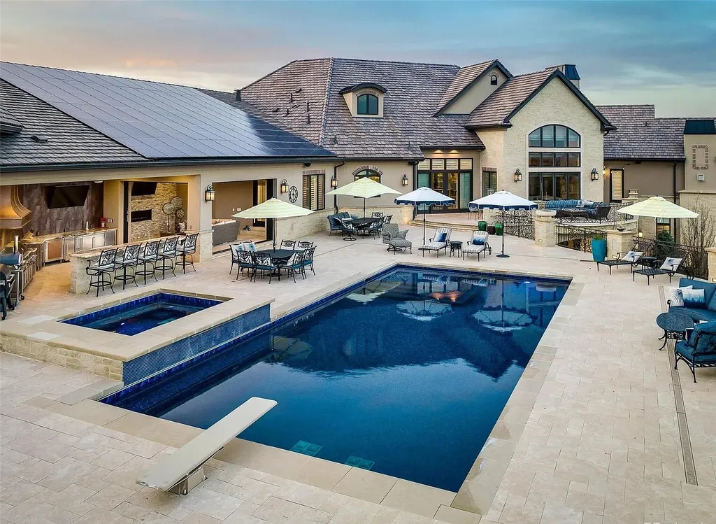 15490 Mountain View Circle Home in Broomfield, Colorado. Discover a one-of-a-kind contemporary custom home nestled on 2.34 acres, offering breathtaking mountain views and sleek designer elements. This thoughtfully designed lifestyle compound boasts unrivaled exclusivity, featuring a garage for 10 cars, a year-round saltwater pool, an outdoor kitchen, a finished basement with a shooting range and golf simulator, and much more. With impeccable construction and attention to detail, this turnkey home offers the epitome of luxurious living.