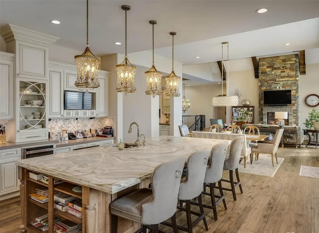 15490 Mountain View Circle Home in Broomfield, Colorado. Discover a one-of-a-kind contemporary custom home nestled on 2.34 acres, offering breathtaking mountain views and sleek designer elements. This thoughtfully designed lifestyle compound boasts unrivaled exclusivity, featuring a garage for 10 cars, a year-round saltwater pool, an outdoor kitchen, a finished basement with a shooting range and golf simulator, and much more. With impeccable construction and attention to detail, this turnkey home offers the epitome of luxurious living.