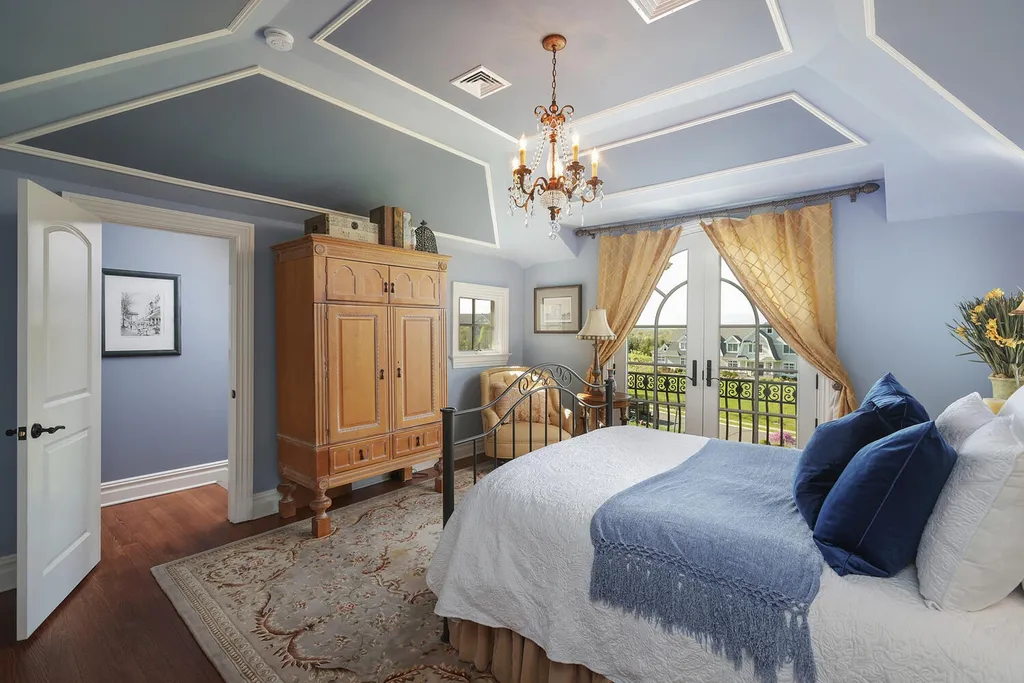 16 Tall Timber Lane Home in Bernards Township, New Jersey. Discover an extraordinary French Chateau-inspired property boasting nearly 12,000 sq ft of living space. This remarkable estate offers unparalleled luxury, featuring special amenities such as an elevator for easy accessibility, a first-floor guest suite, and radiant heated floors throughout, including the basement and garage. Indulge in the opulent 4,200 sq ft walk-out lower level, featuring high ceilings, a movie theater, expansive bar, gym, full spa bathroom with sauna, workshop, second laundry room, multiple entertainment areas, and potential for a sixth bedroom ensuite.