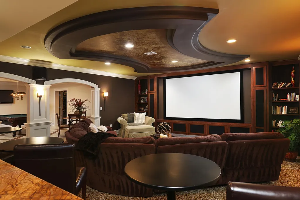 16 Tall Timber Lane Home in Bernards Township, New Jersey. Discover an extraordinary French Chateau-inspired property boasting nearly 12,000 sq ft of living space. This remarkable estate offers unparalleled luxury, featuring special amenities such as an elevator for easy accessibility, a first-floor guest suite, and radiant heated floors throughout, including the basement and garage. Indulge in the opulent 4,200 sq ft walk-out lower level, featuring high ceilings, a movie theater, expansive bar, gym, full spa bathroom with sauna, workshop, second laundry room, multiple entertainment areas, and potential for a sixth bedroom ensuite.