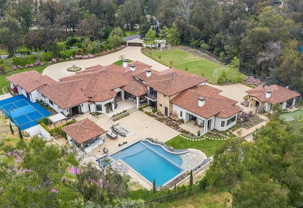 16109 Rambla De Las Flores Home in Rancho Santa Fe, California. The property is situated on 2.7 acres of land and features a detached guest house with a kitchen, as well as a master retreat with a private patio overlooking the pool, spa, and grounds. 