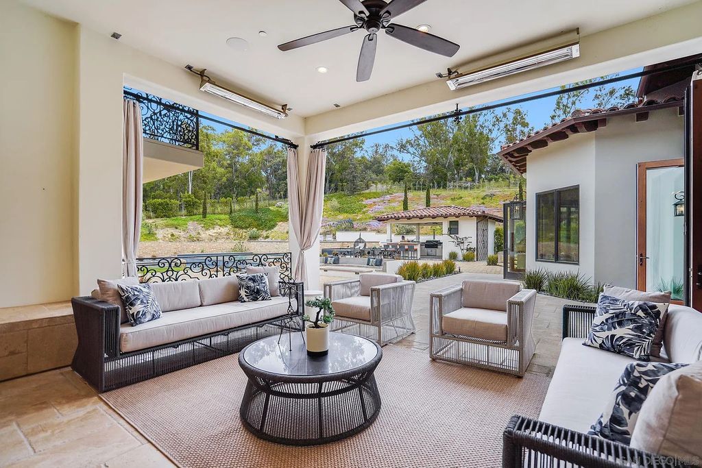 16109 Rambla De Las Flores Home in Rancho Santa Fe, California. The property is situated on 2.7 acres of land and features a detached guest house with a kitchen, as well as a master retreat with a private patio overlooking the pool, spa, and grounds. 