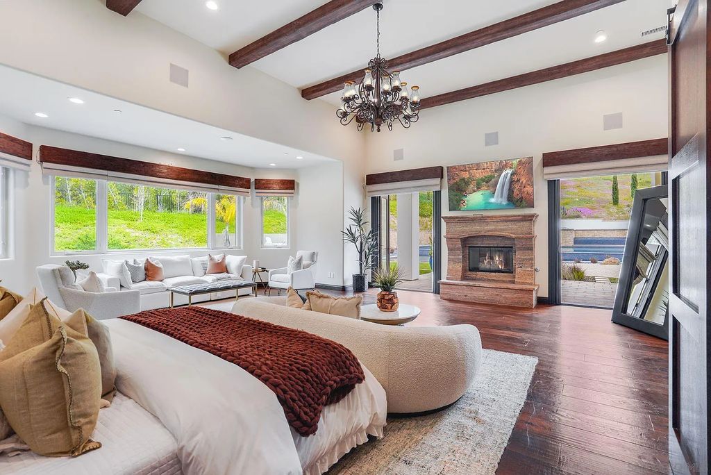 16109 Rambla De Las Flores Home in Rancho Santa Fe, California. The property is situated on 2.7 acres of land and features a detached guest house with a kitchen, as well as a master retreat with a private patio overlooking the pool, spa, and grounds. 