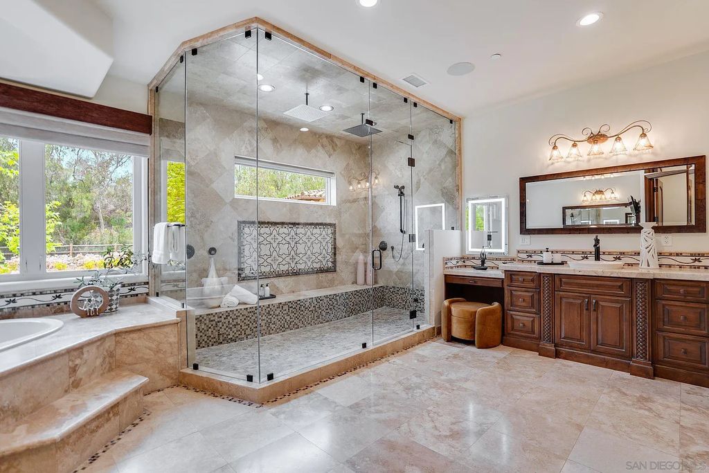 16109 Rambla De Las Flores Home in Rancho Santa Fe, California. The property is situated on 2.7 acres of land and features a detached guest house with a kitchen, as well as a master retreat with a private patio overlooking the pool, spa, and grounds. 