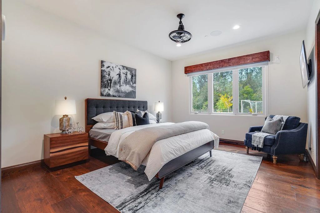 16109 Rambla De Las Flores Home in Rancho Santa Fe, California. The property is situated on 2.7 acres of land and features a detached guest house with a kitchen, as well as a master retreat with a private patio overlooking the pool, spa, and grounds. 