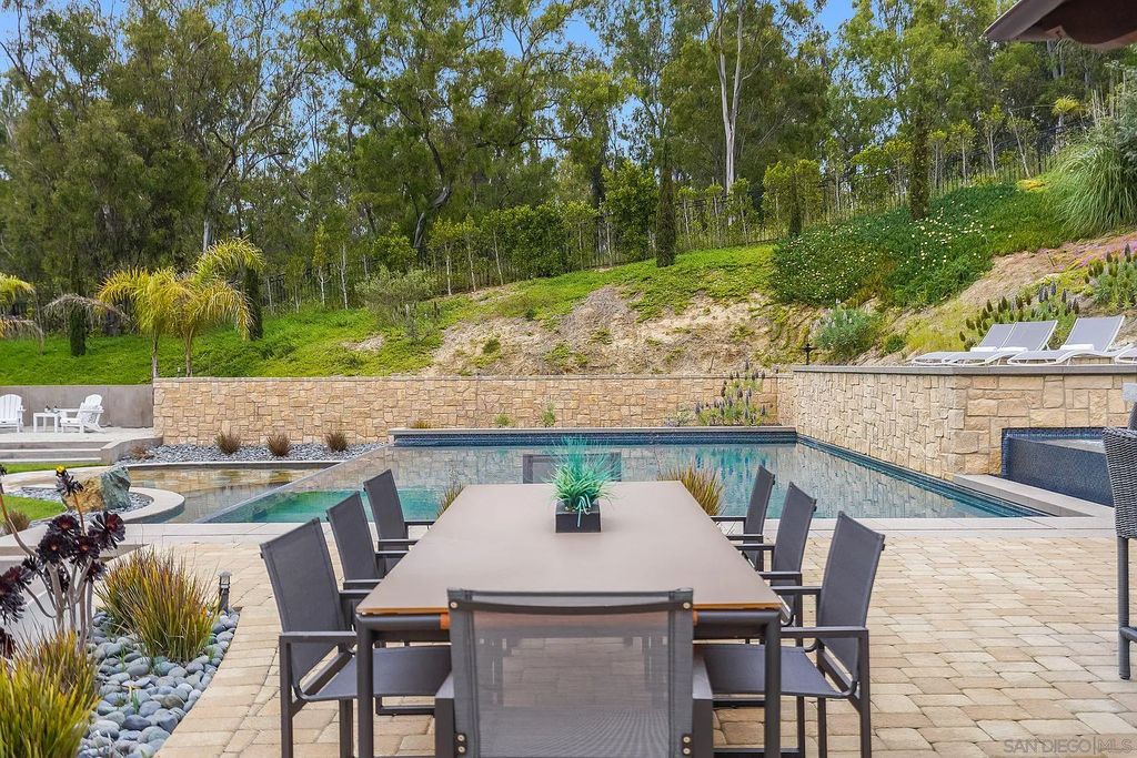 16109 Rambla De Las Flores Home in Rancho Santa Fe, California. The property is situated on 2.7 acres of land and features a detached guest house with a kitchen, as well as a master retreat with a private patio overlooking the pool, spa, and grounds. 