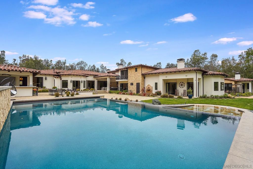 16109 Rambla De Las Flores Home in Rancho Santa Fe, California. The property is situated on 2.7 acres of land and features a detached guest house with a kitchen, as well as a master retreat with a private patio overlooking the pool, spa, and grounds. 