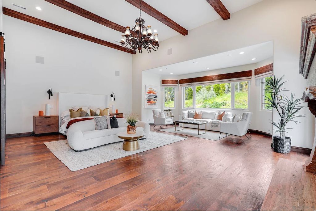 16109 Rambla De Las Flores Home in Rancho Santa Fe, California. The property is situated on 2.7 acres of land and features a detached guest house with a kitchen, as well as a master retreat with a private patio overlooking the pool, spa, and grounds. 
