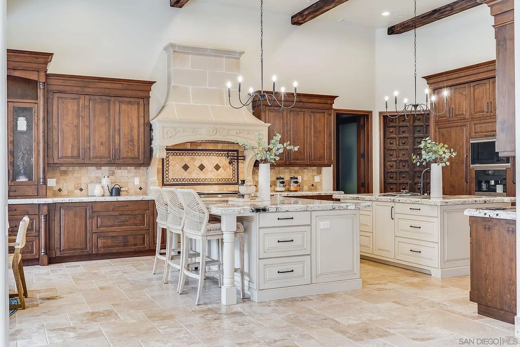 16109 Rambla De Las Flores Home in Rancho Santa Fe, California. The property is situated on 2.7 acres of land and features a detached guest house with a kitchen, as well as a master retreat with a private patio overlooking the pool, spa, and grounds. 