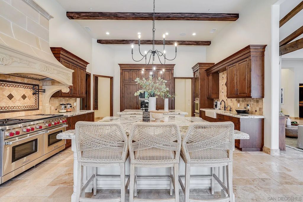 16109 Rambla De Las Flores Home in Rancho Santa Fe, California. The property is situated on 2.7 acres of land and features a detached guest house with a kitchen, as well as a master retreat with a private patio overlooking the pool, spa, and grounds. 