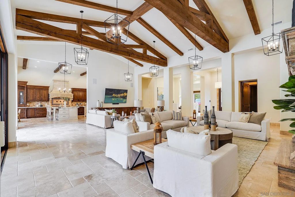 16109 Rambla De Las Flores Home in Rancho Santa Fe, California. The property is situated on 2.7 acres of land and features a detached guest house with a kitchen, as well as a master retreat with a private patio overlooking the pool, spa, and grounds. 