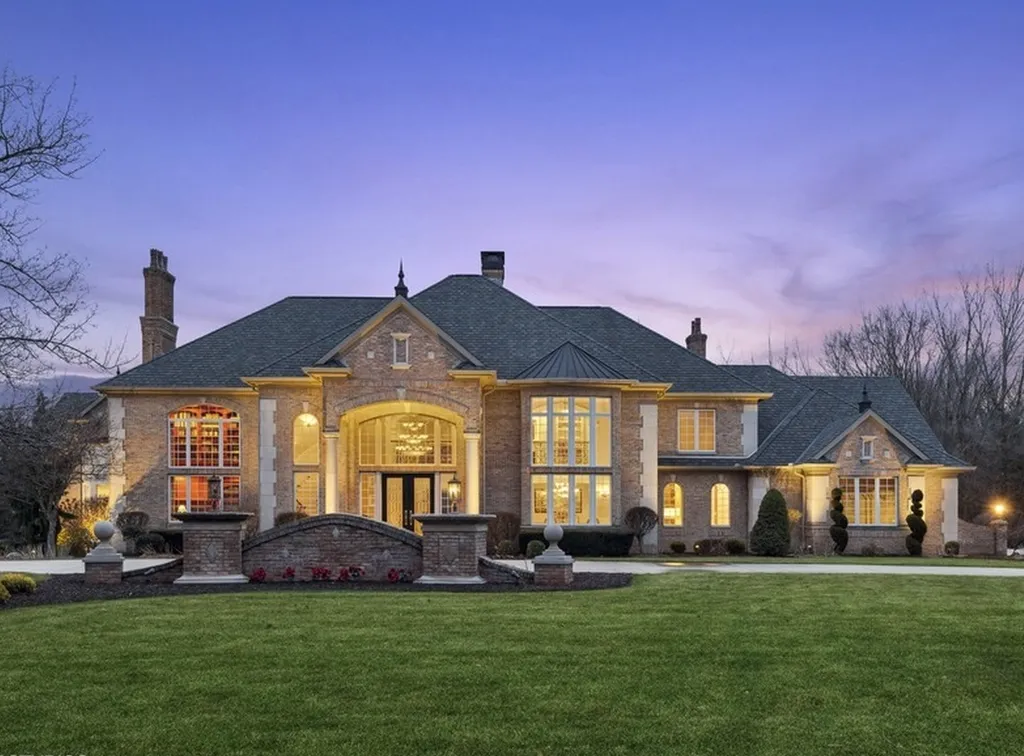 17540 Dublin Drive Home in Granger, Indiana. Experience the epitome of luxury in this magnificent 12,000+ square foot estate situated on a premier 2.65-acre lot with serene wooded views in the prestigious gated community of Shamrock Hills. Every detail of this gracious home showcases the finest materials and craftsmanship, resulting in an unparalleled living experience. Custom millwork, an elevator, and an array of exceptional features elevate this residence to the highest level of sophistication.