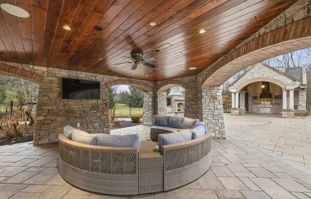 17540 Dublin Drive Home in Granger, Indiana. Experience the epitome of luxury in this magnificent 12,000+ square foot estate situated on a premier 2.65-acre lot with serene wooded views in the prestigious gated community of Shamrock Hills. Every detail of this gracious home showcases the finest materials and craftsmanship, resulting in an unparalleled living experience. Custom millwork, an elevator, and an array of exceptional features elevate this residence to the highest level of sophistication.