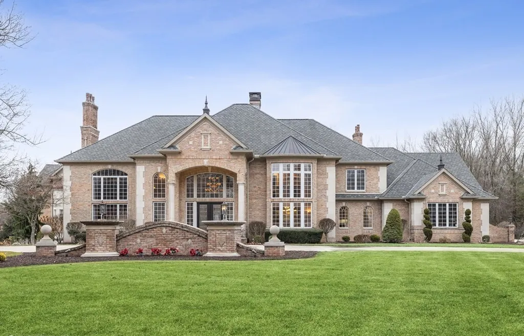17540 Dublin Drive Home in Granger, Indiana. Experience the epitome of luxury in this magnificent 12,000+ square foot estate situated on a premier 2.65-acre lot with serene wooded views in the prestigious gated community of Shamrock Hills. Every detail of this gracious home showcases the finest materials and craftsmanship, resulting in an unparalleled living experience. Custom millwork, an elevator, and an array of exceptional features elevate this residence to the highest level of sophistication.