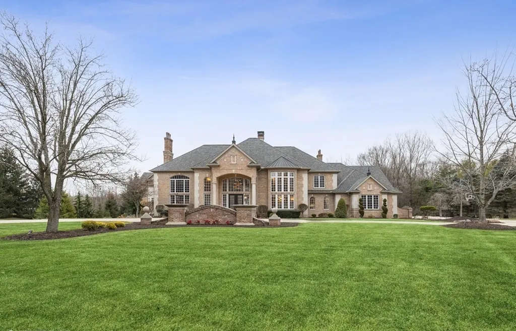 17540 Dublin Drive Home in Granger, Indiana. Experience the epitome of luxury in this magnificent 12,000+ square foot estate situated on a premier 2.65-acre lot with serene wooded views in the prestigious gated community of Shamrock Hills. Every detail of this gracious home showcases the finest materials and craftsmanship, resulting in an unparalleled living experience. Custom millwork, an elevator, and an array of exceptional features elevate this residence to the highest level of sophistication.