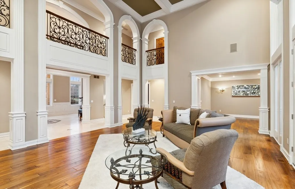 17540 Dublin Drive Home in Granger, Indiana. Experience the epitome of luxury in this magnificent 12,000+ square foot estate situated on a premier 2.65-acre lot with serene wooded views in the prestigious gated community of Shamrock Hills. Every detail of this gracious home showcases the finest materials and craftsmanship, resulting in an unparalleled living experience. Custom millwork, an elevator, and an array of exceptional features elevate this residence to the highest level of sophistication.