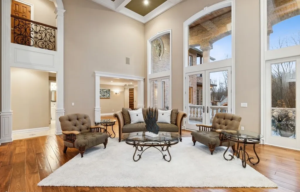 17540 Dublin Drive Home in Granger, Indiana. Experience the epitome of luxury in this magnificent 12,000+ square foot estate situated on a premier 2.65-acre lot with serene wooded views in the prestigious gated community of Shamrock Hills. Every detail of this gracious home showcases the finest materials and craftsmanship, resulting in an unparalleled living experience. Custom millwork, an elevator, and an array of exceptional features elevate this residence to the highest level of sophistication.