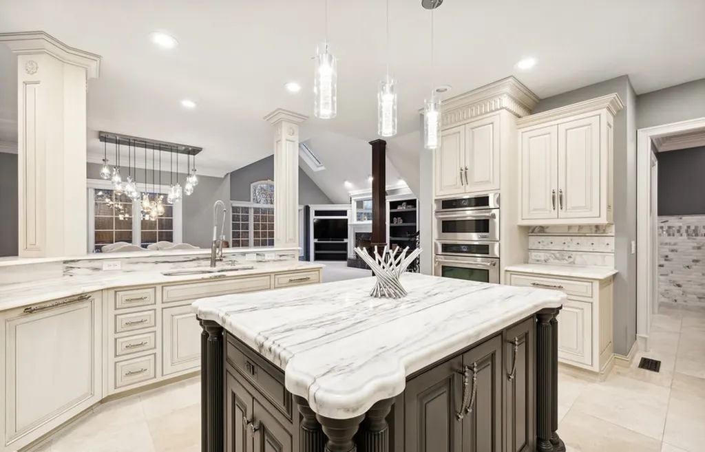 17540 Dublin Drive Home in Granger, Indiana. Experience the epitome of luxury in this magnificent 12,000+ square foot estate situated on a premier 2.65-acre lot with serene wooded views in the prestigious gated community of Shamrock Hills. Every detail of this gracious home showcases the finest materials and craftsmanship, resulting in an unparalleled living experience. Custom millwork, an elevator, and an array of exceptional features elevate this residence to the highest level of sophistication.