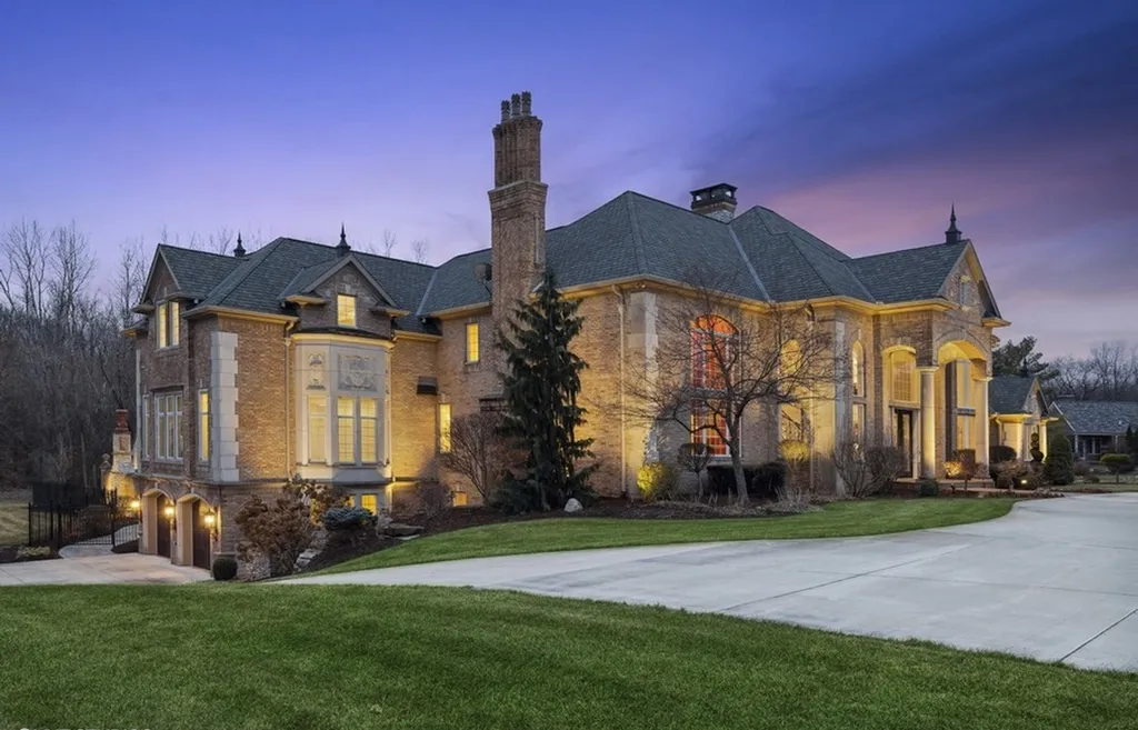 17540 Dublin Drive Home in Granger, Indiana. Experience the epitome of luxury in this magnificent 12,000+ square foot estate situated on a premier 2.65-acre lot with serene wooded views in the prestigious gated community of Shamrock Hills. Every detail of this gracious home showcases the finest materials and craftsmanship, resulting in an unparalleled living experience. Custom millwork, an elevator, and an array of exceptional features elevate this residence to the highest level of sophistication.