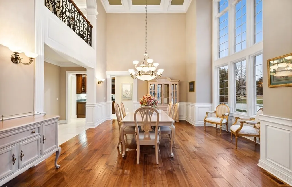 17540 Dublin Drive Home in Granger, Indiana. Experience the epitome of luxury in this magnificent 12,000+ square foot estate situated on a premier 2.65-acre lot with serene wooded views in the prestigious gated community of Shamrock Hills. Every detail of this gracious home showcases the finest materials and craftsmanship, resulting in an unparalleled living experience. Custom millwork, an elevator, and an array of exceptional features elevate this residence to the highest level of sophistication.