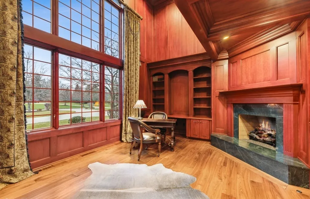 17540 Dublin Drive Home in Granger, Indiana. Experience the epitome of luxury in this magnificent 12,000+ square foot estate situated on a premier 2.65-acre lot with serene wooded views in the prestigious gated community of Shamrock Hills. Every detail of this gracious home showcases the finest materials and craftsmanship, resulting in an unparalleled living experience. Custom millwork, an elevator, and an array of exceptional features elevate this residence to the highest level of sophistication.