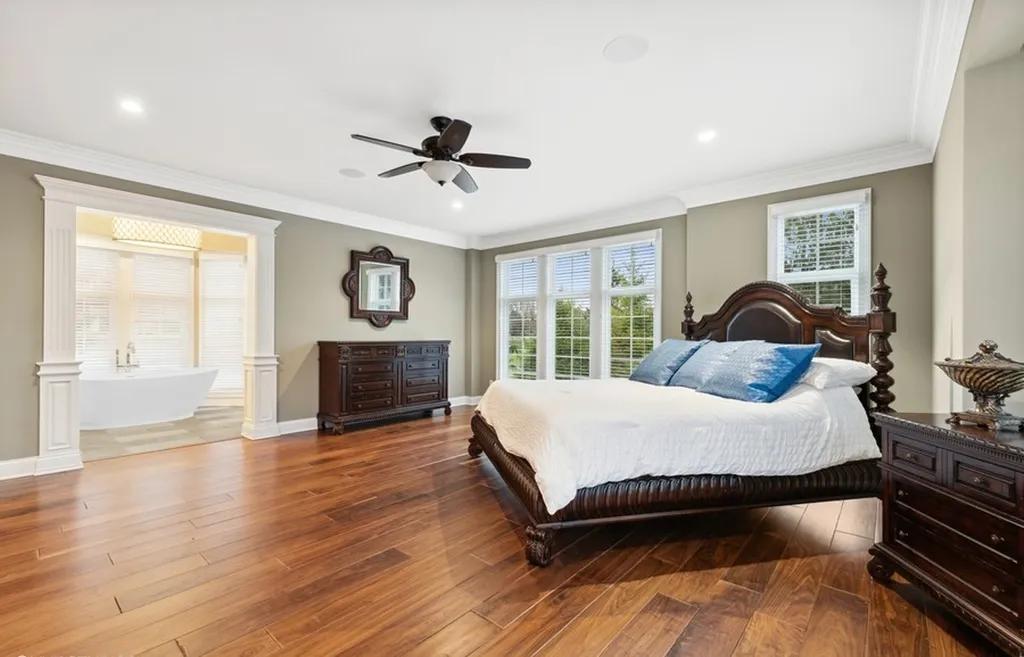 17540 Dublin Drive Home in Granger, Indiana. Experience the epitome of luxury in this magnificent 12,000+ square foot estate situated on a premier 2.65-acre lot with serene wooded views in the prestigious gated community of Shamrock Hills. Every detail of this gracious home showcases the finest materials and craftsmanship, resulting in an unparalleled living experience. Custom millwork, an elevator, and an array of exceptional features elevate this residence to the highest level of sophistication.