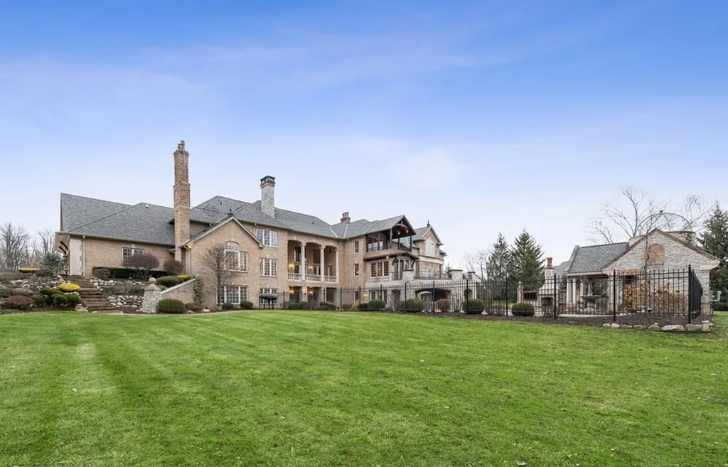 17540 Dublin Drive Home in Granger, Indiana. Experience the epitome of luxury in this magnificent 12,000+ square foot estate situated on a premier 2.65-acre lot with serene wooded views in the prestigious gated community of Shamrock Hills. Every detail of this gracious home showcases the finest materials and craftsmanship, resulting in an unparalleled living experience. Custom millwork, an elevator, and an array of exceptional features elevate this residence to the highest level of sophistication.