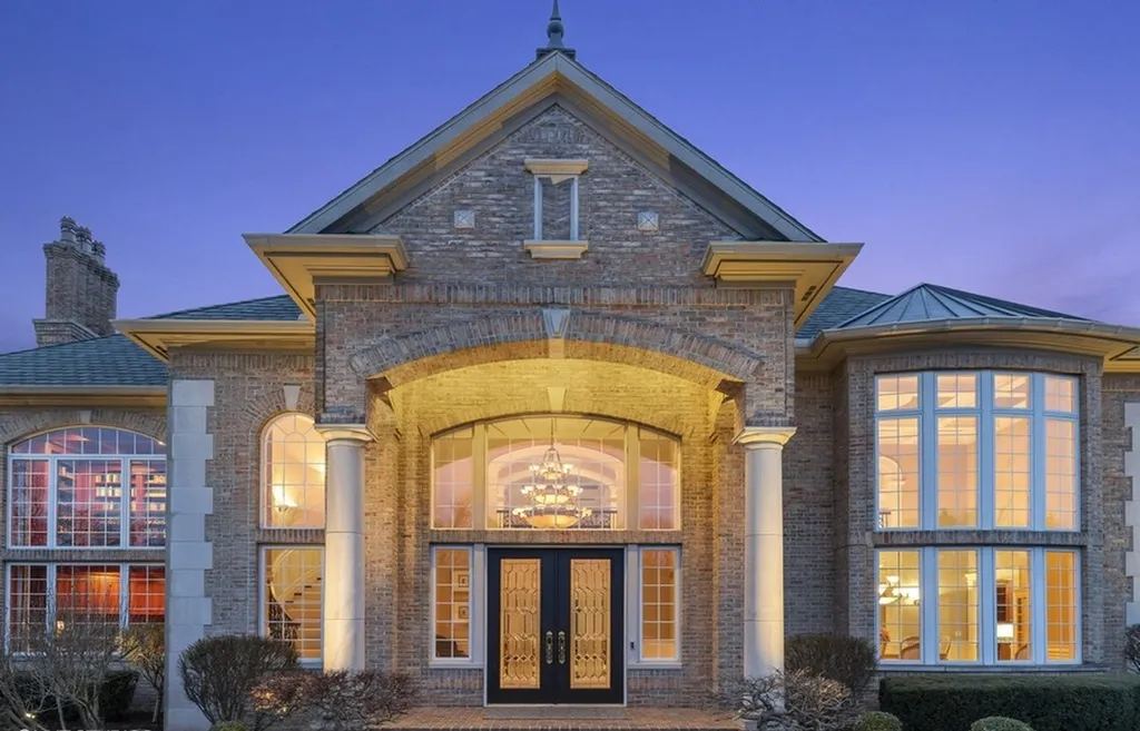 17540 Dublin Drive Home in Granger, Indiana. Experience the epitome of luxury in this magnificent 12,000+ square foot estate situated on a premier 2.65-acre lot with serene wooded views in the prestigious gated community of Shamrock Hills. Every detail of this gracious home showcases the finest materials and craftsmanship, resulting in an unparalleled living experience. Custom millwork, an elevator, and an array of exceptional features elevate this residence to the highest level of sophistication.