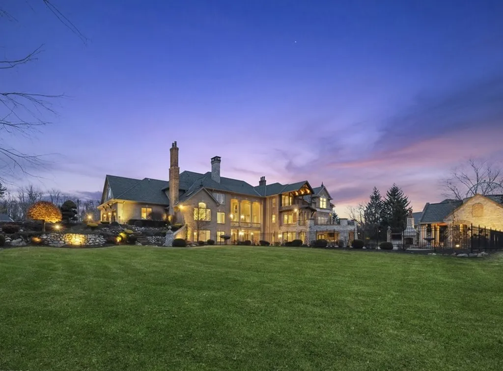 17540 Dublin Drive Home in Granger, Indiana. Experience the epitome of luxury in this magnificent 12,000+ square foot estate situated on a premier 2.65-acre lot with serene wooded views in the prestigious gated community of Shamrock Hills. Every detail of this gracious home showcases the finest materials and craftsmanship, resulting in an unparalleled living experience. Custom millwork, an elevator, and an array of exceptional features elevate this residence to the highest level of sophistication.
